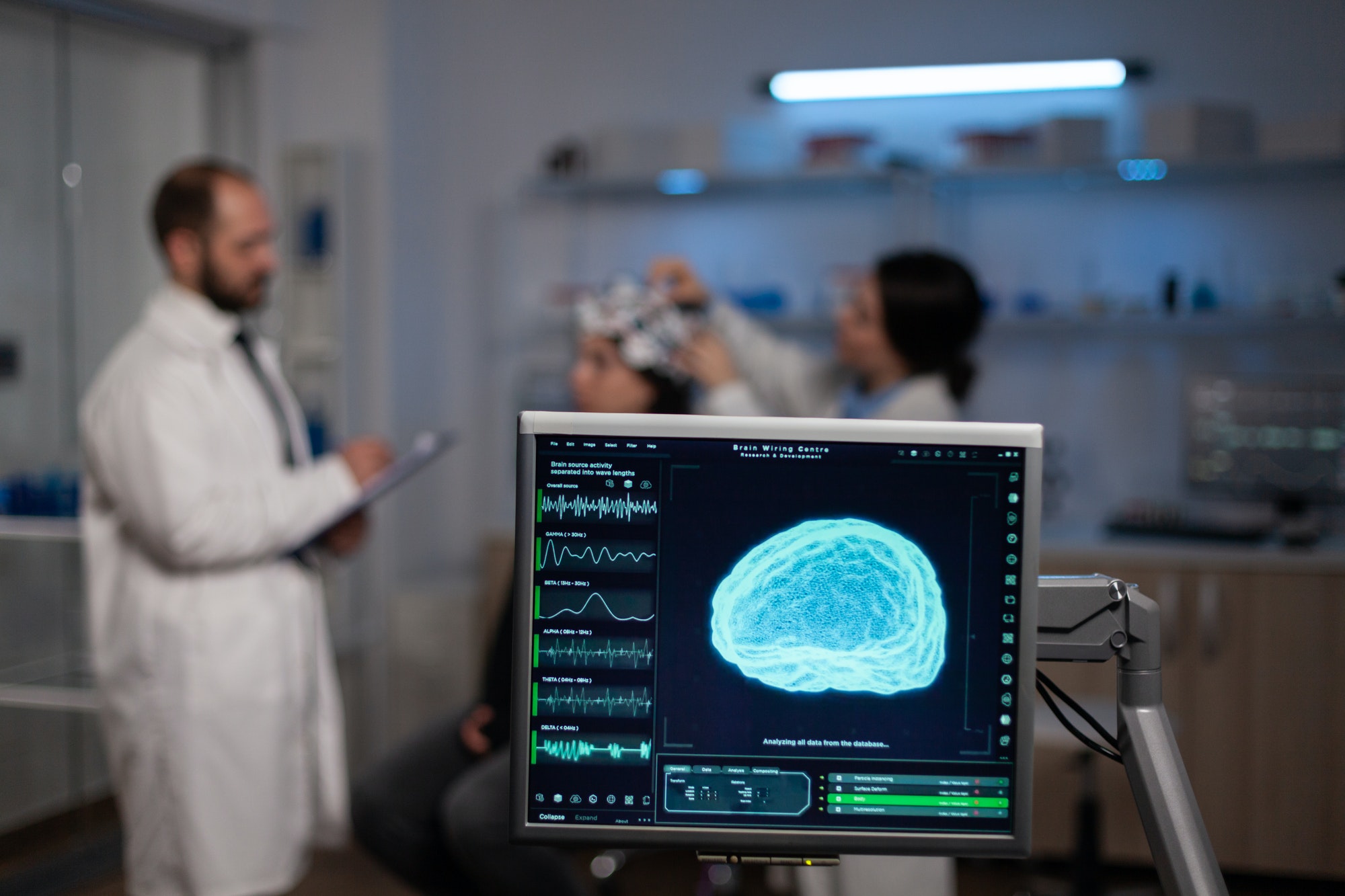 Monitor with brain activity on screen in neurology medical laboratory